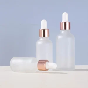 Rose gold-rimmed Frosted Glass Dropper Bottle with Round Shoulder
