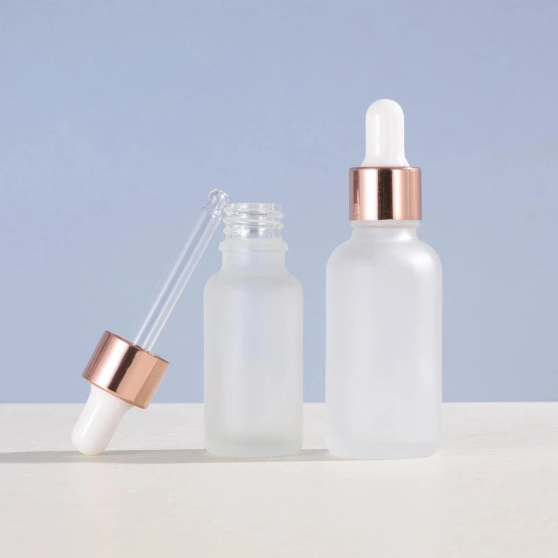 Rose gold-rimmed Frosted Glass Dropper Bottle with Round Shoulder Rose gold-rimmed Frosted Glass Dropper Bottle with Round Shoulder