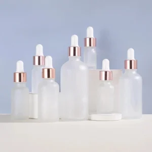Rose gold-rimmed Frosted Glass Dropper Bottle with Round Shoulder