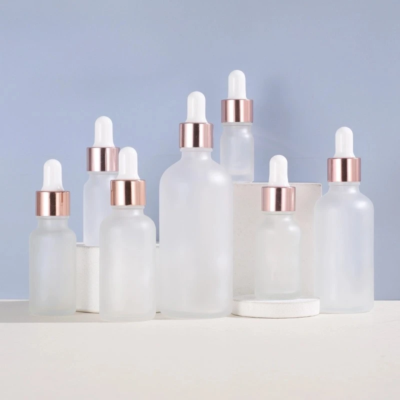 Rose gold-rimmed Frosted Glass Dropper Bottle with Round Shoulder